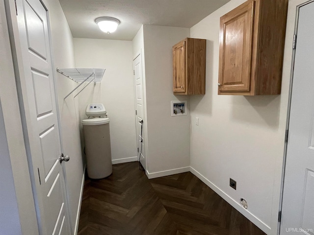 laundry area with hookup for a washing machine, cabinets, dark parquet flooring, and electric dryer hookup