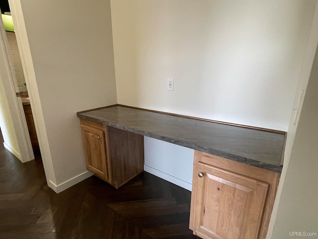 details featuring built in desk and parquet floors