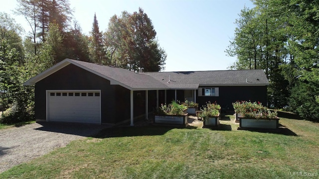 single story home with an attached garage, a front lawn, and dirt driveway