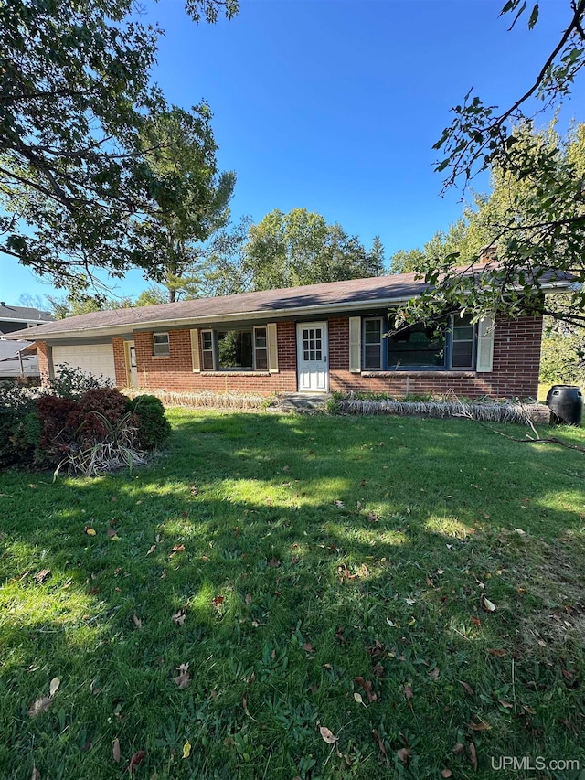 ranch-style home with a front lawn