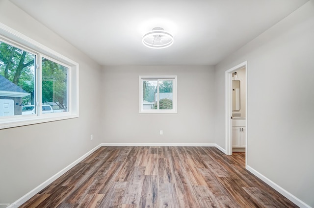 spare room with dark wood-type flooring