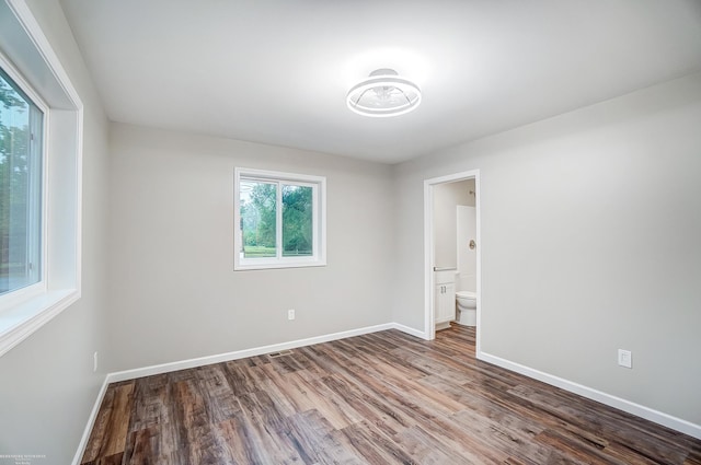 unfurnished room featuring hardwood / wood-style floors