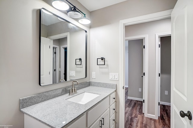 bathroom featuring vanity and hardwood / wood-style floors