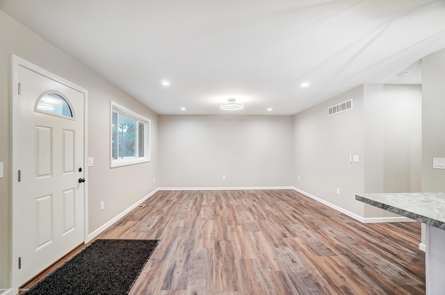 entrance foyer featuring hardwood / wood-style floors