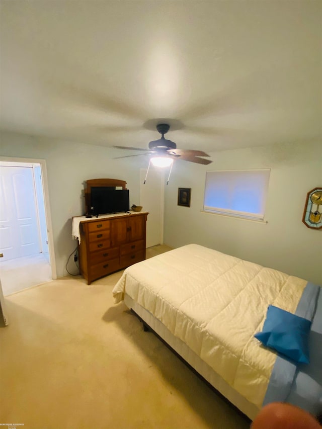 bedroom featuring ceiling fan and light colored carpet