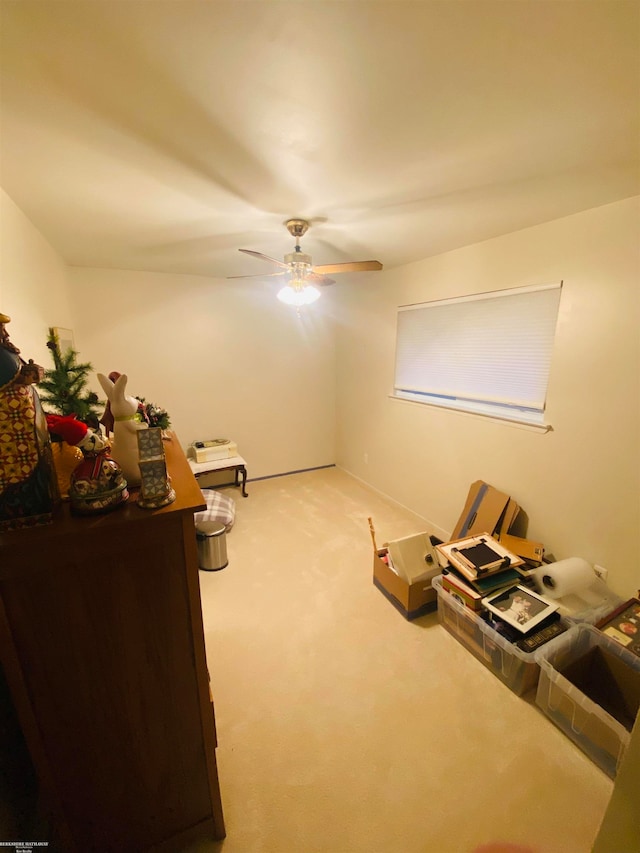 miscellaneous room featuring ceiling fan and carpet floors