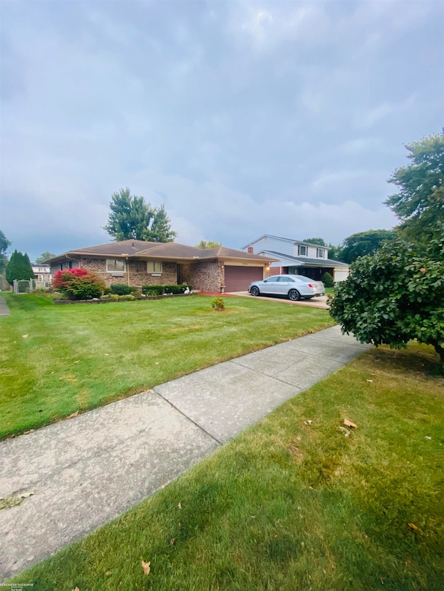 exterior space featuring a garage and a front lawn