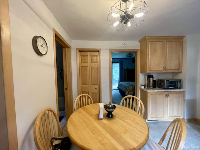 156 N Carlshend Rd, Skandia, MI 49885 - dining area with a toaster and an inviting chandelier