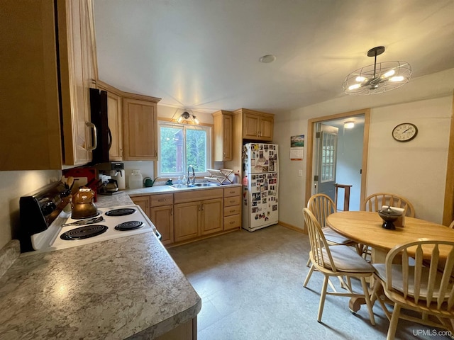 156 N Carlshend Rd, Skandia, MI 49885 - kitchen with light countertops, light brown cabinets, a sink, electric range oven, and a notable chandelier
