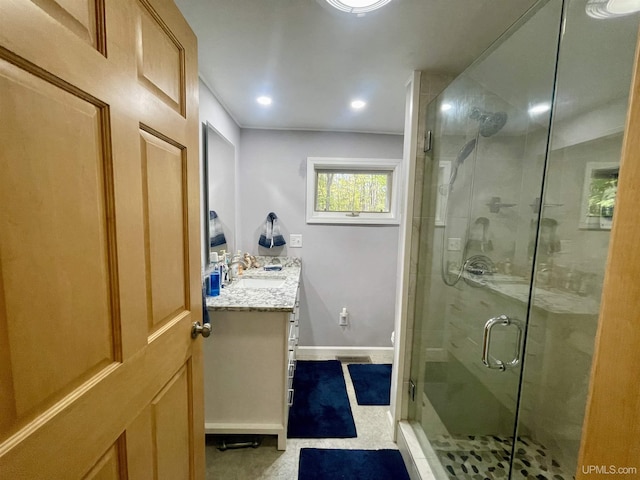 156 N Carlshend Rd, Skandia, MI 49885 - bathroom featuring vanity, baseboards, recessed lighting, and a shower stall