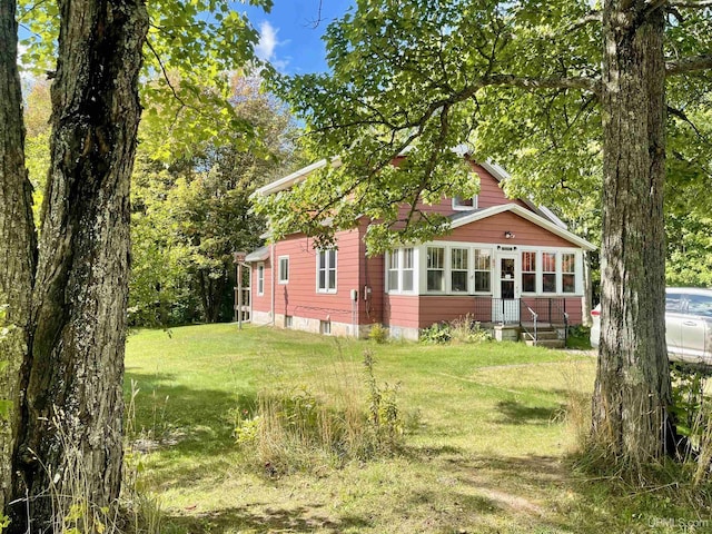 156 N Carlshend Rd, Skandia, MI 49885 - back of house with a yard