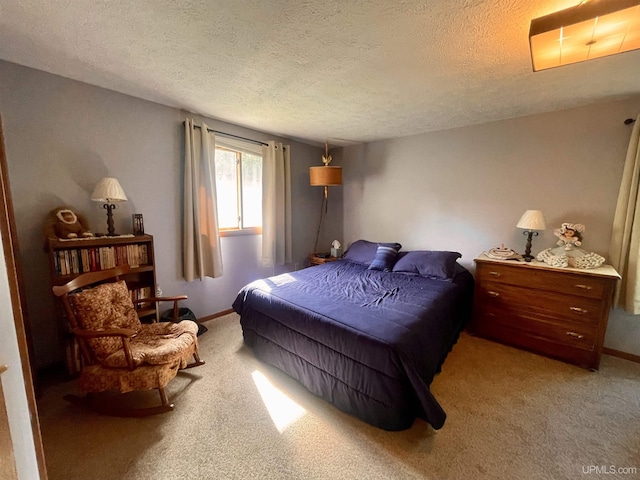 156 N Carlshend Rd, Skandia, MI 49885 - bedroom featuring light carpet, baseboards, and a textured ceiling