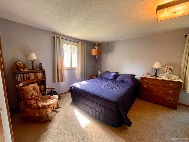 carpeted bedroom with a textured ceiling