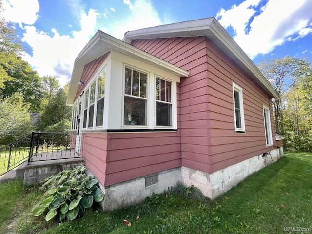 156 N Carlshend Rd, Skandia, MI 49885 - view of side of home with a yard