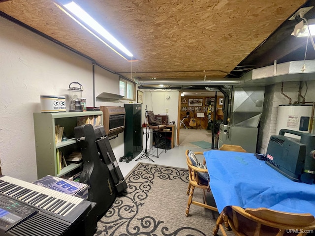 156 N Carlshend Rd, Skandia, MI 49885 - finished basement with water heater, heating unit, and a textured wall