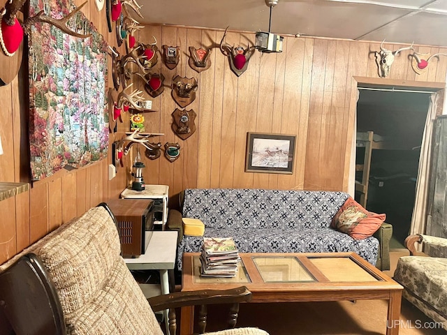 living room with wood walls