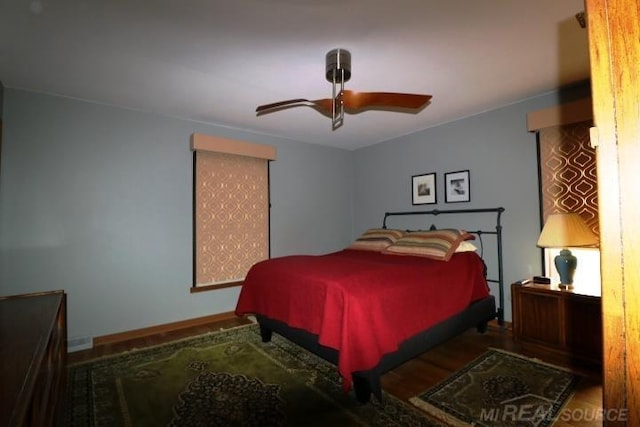 bedroom with ceiling fan and hardwood / wood-style floors