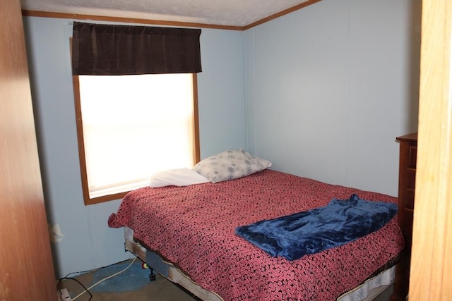 bedroom with ornamental molding