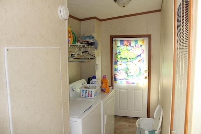 washroom with separate washer and dryer and ornamental molding