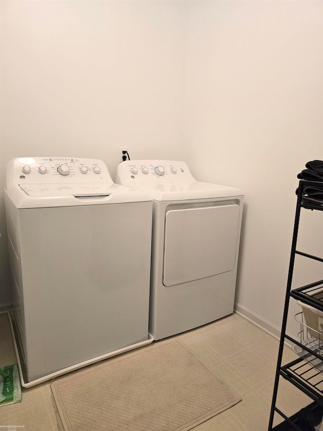 clothes washing area with independent washer and dryer