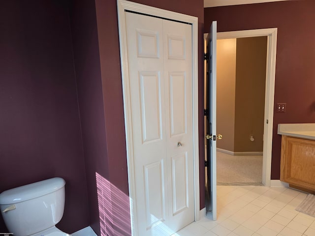 bathroom featuring toilet and tile patterned floors