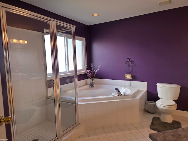 bathroom featuring shower with separate bathtub, toilet, and tile patterned floors