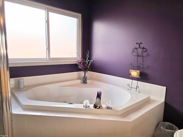 bathroom with tiled tub