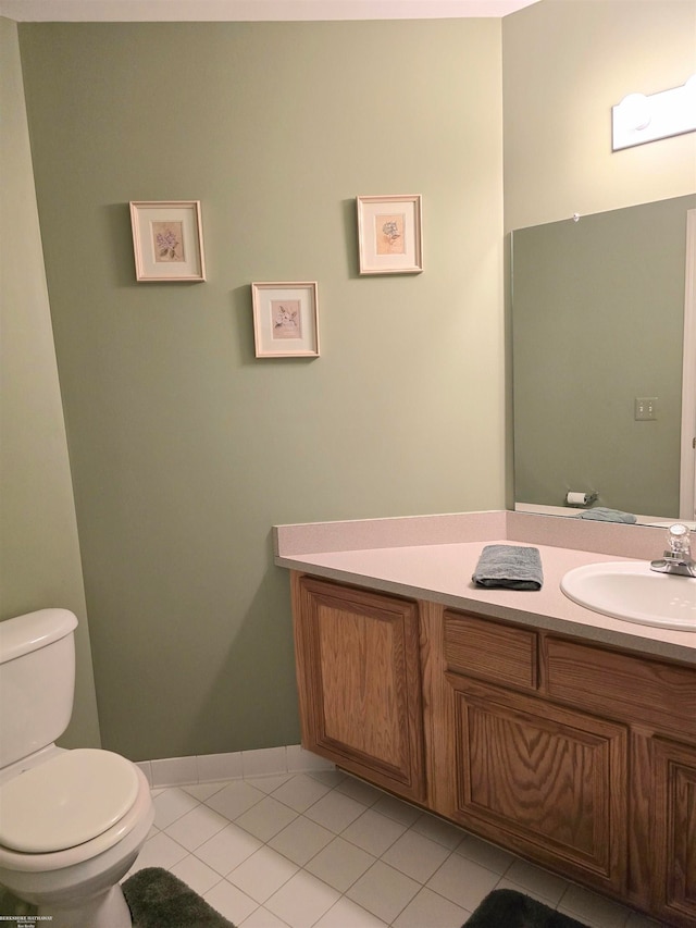 bathroom featuring vanity, toilet, and tile patterned floors