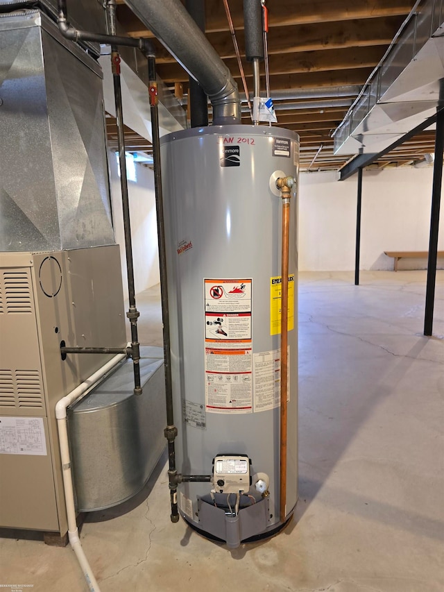 utility room featuring gas water heater