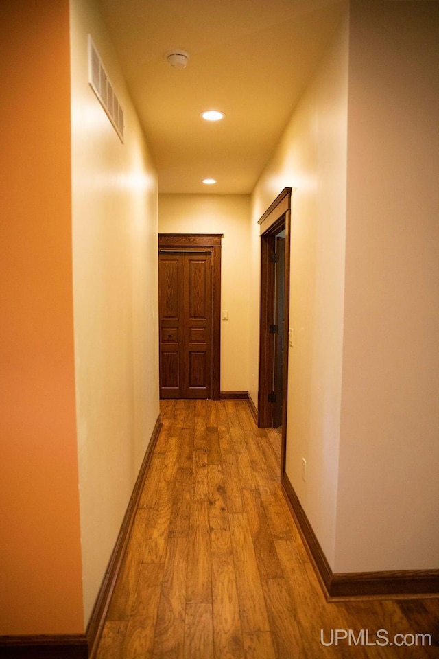 hall with light hardwood / wood-style flooring