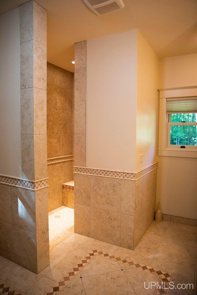 bathroom featuring tile walls and tile patterned flooring