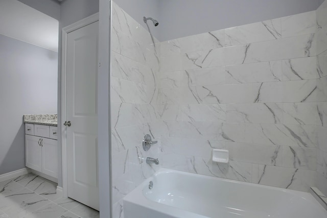 bathroom with vanity and tiled shower / bath combo