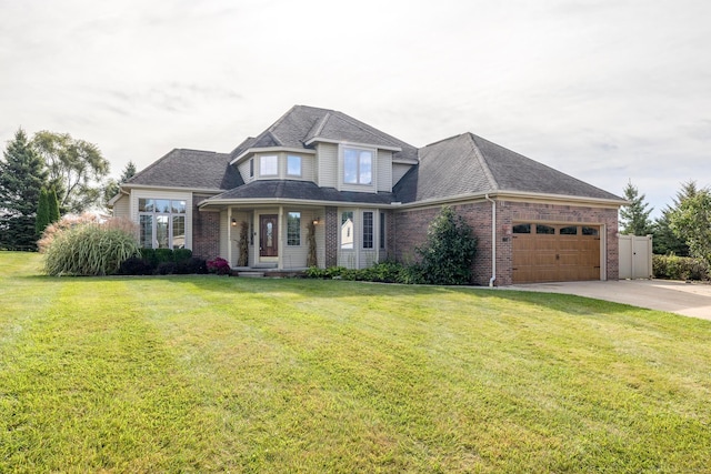 view of front of house with a front yard and a garage