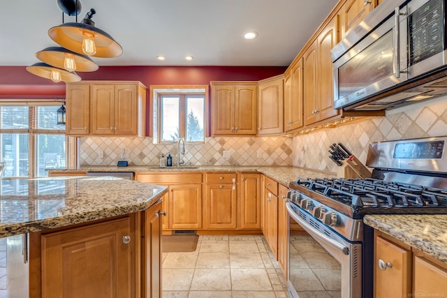 kitchen featuring tasteful backsplash, sink, stainless steel appliances, light tile patterned floors, and light stone countertops