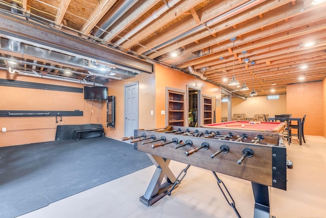 playroom featuring concrete flooring