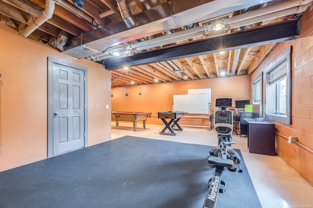 exercise area featuring pool table and concrete floors