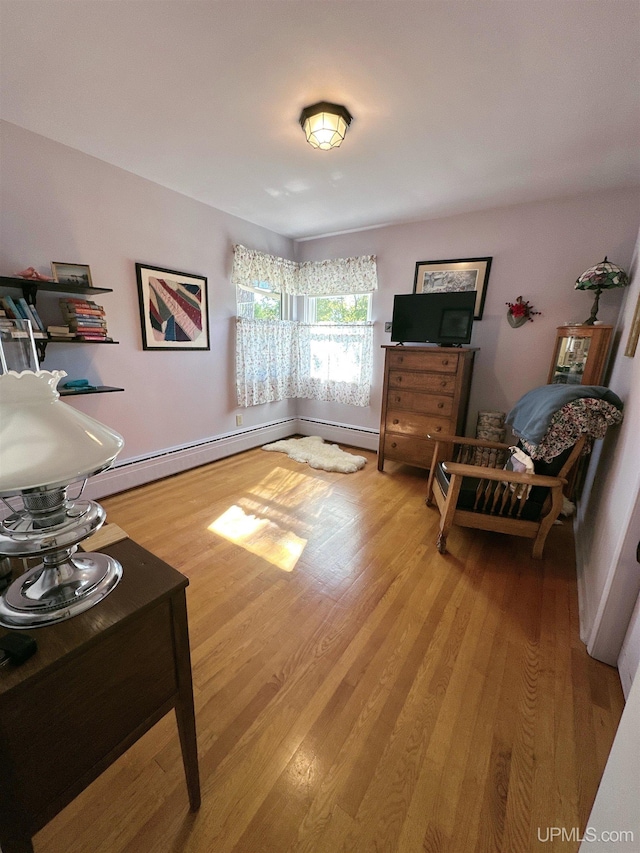 sitting room with hardwood / wood-style floors