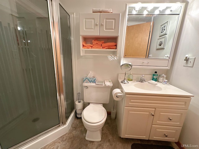 bathroom with walk in shower, vanity, and toilet