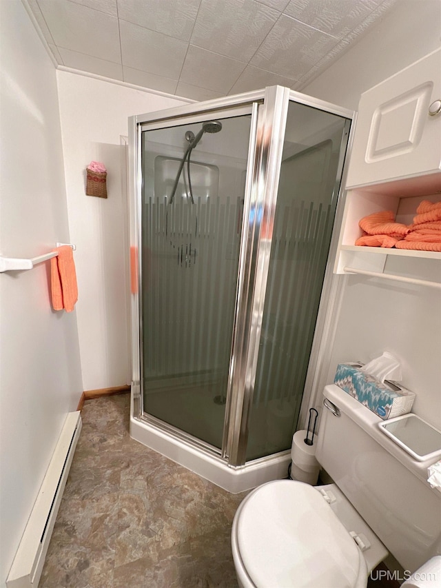 bathroom with a baseboard heating unit, walk in shower, and toilet