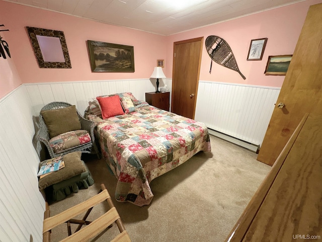 carpeted bedroom featuring a baseboard radiator