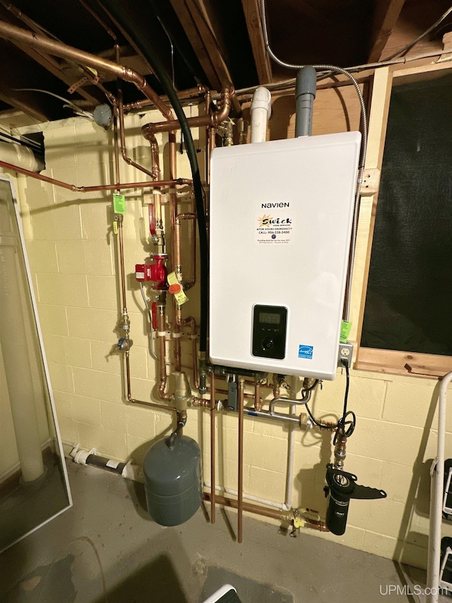 utility room with tankless water heater