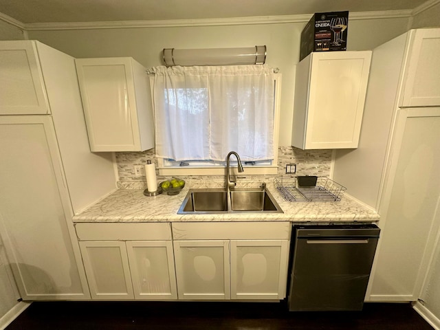 kitchen featuring white cabinetry, sink, light stone counters, and tasteful backsplash