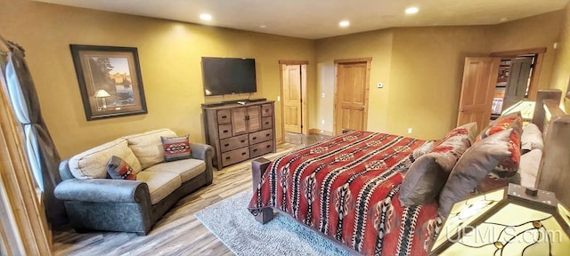 bedroom with light hardwood / wood-style flooring