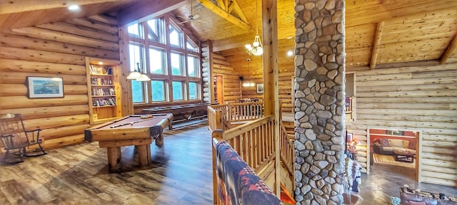 game room featuring pool table, beam ceiling, high vaulted ceiling, hardwood / wood-style floors, and rustic walls