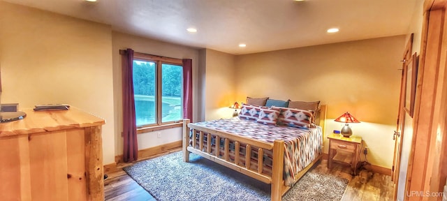 bedroom featuring dark hardwood / wood-style floors