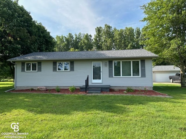 single story home featuring a garage and a front lawn