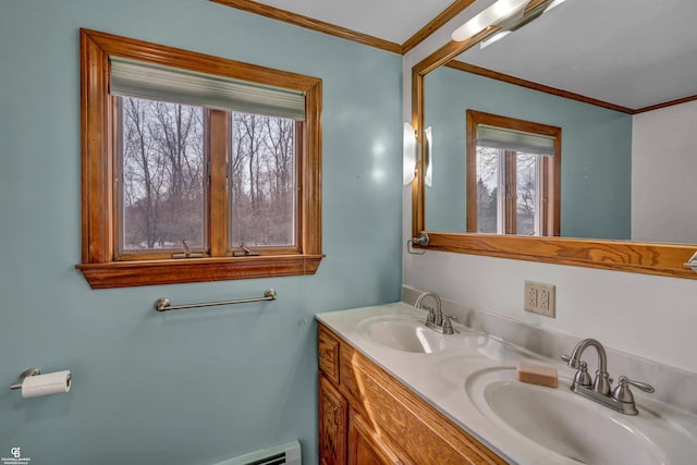 bathroom with ornamental molding and vanity