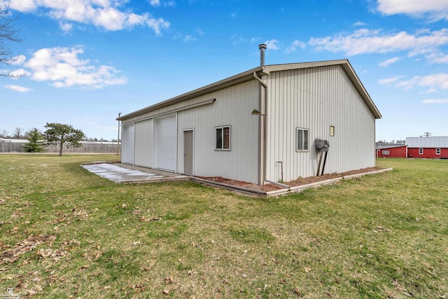 view of outbuilding featuring a lawn