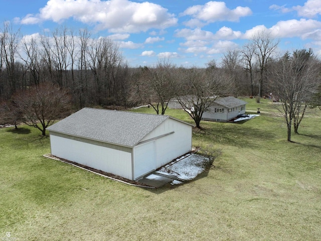 view of outbuilding with a lawn