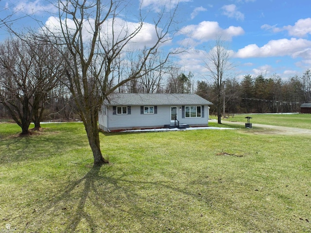 ranch-style home with a front lawn